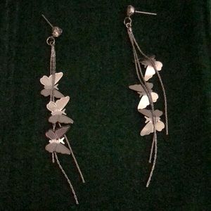 Silver butterfly dangly earrings.